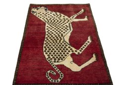 Surface texture of 2000s Persian Gabbeh rug with natural Wool and intricate pattern