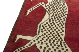 Backside of handmade 2000s Persian Gabbeh rug showing knot structure and weave density