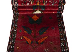 Corner detail of 2000s Persian Gabbeh rug showing border pattern and Wool pile