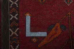 Surface texture of 2000s Persian Gabbeh rug with natural Wool and intricate pattern