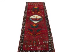 Surface texture of 2000s Persian Gabbeh rug with natural Wool and intricate pattern