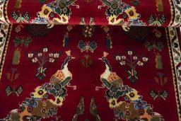 Corner detail of 2000s Persian Gabbeh rug showing border pattern and Wool pile