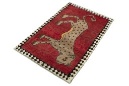 Corner detail of 2000s Persian Gabbeh rug showing border pattern and Wool pile