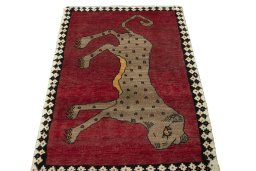Surface texture of 2000s Persian Gabbeh rug with natural Wool and intricate pattern