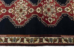 Close-up detail of 2000s Persian Gabbeh rug from Iran / Persia showing Wool weave