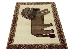 Surface texture of 2000s Persian Gabbeh rug with natural Wool and intricate pattern