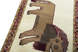 Backside of handmade 2000s Persian Gabbeh rug showing knot structure and weave density