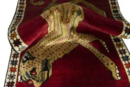 Corner detail of 2000s Persian Gabbeh rug showing border pattern and Wool pile