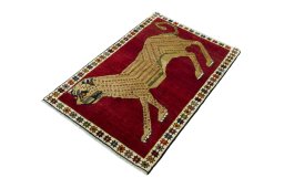 Corner detail of 2000s Persian Gabbeh rug showing border pattern and Wool pile