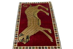 Surface texture of 2000s Persian Gabbeh rug with natural Wool and intricate pattern
