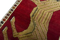 Backside of handmade 2000s Persian Gabbeh rug showing knot structure and weave density