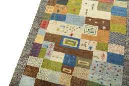 Backside of handmade New Persian Gabbeh rug showing knot structure and weave density