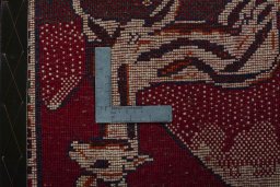 Backside of handmade 2000s Persian Gabbeh rug showing knot structure and weave density
