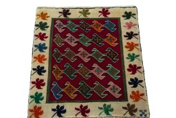 Surface texture of 2000s Persian Gabbeh rug with natural Wool and intricate pattern