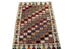 Surface texture of 2000s Persian Gabbeh rug with natural Wool and intricate pattern