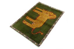 Corner detail of 2000s Persian Gabbeh rug showing border pattern and Wool pile
