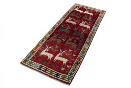 Corner detail of 2000s Persian Gabbeh rug showing border pattern and Wool pile