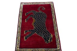 Surface texture of 2000s Persian Gabbeh rug with natural Wool and intricate pattern