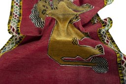 Corner detail of 2000s Persian Gabbeh rug showing border pattern and Wool pile