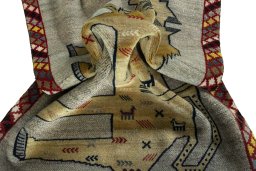 Corner detail of 2000s Persian Gabbeh rug showing border pattern and Wool pile