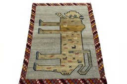 Surface texture of 2000s Persian Gabbeh rug with natural Wool and intricate pattern