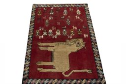 Surface texture of 2000s Persian Gabbeh rug with natural Wool and intricate pattern