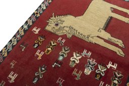 Backside of handmade 2000s Persian Gabbeh rug showing knot structure and weave density