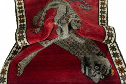 Corner detail of 2000s Persian Gabbeh rug showing border pattern and Wool pile