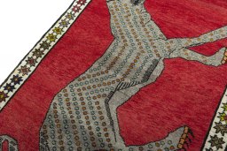 Backside of handmade 2000s Persian Gabbeh rug showing knot structure and weave density