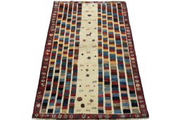 Surface texture of 2000s Persian Gabbeh rug with natural Wool and intricate pattern