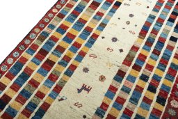 Backside of handmade 2000s Persian Gabbeh rug showing knot structure and weave density