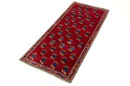 Corner detail of 2000s Persian Gabbeh rug showing border pattern and Wool pile