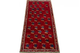 Surface texture of 2000s Persian Gabbeh rug with natural Wool and intricate pattern