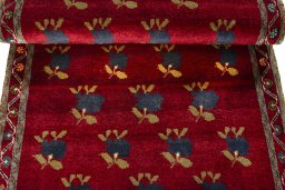 Full view of 2000s Persian Gabbeh rug from Iran / Persia, 200 × 86 cm in Red tones