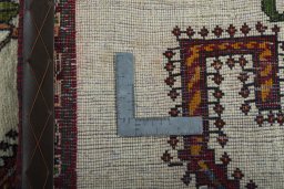 Surface texture of 2000s Persian Gabbeh rug with natural Wool and intricate pattern