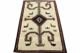 Surface texture of 2000s Persian Gabbeh rug with natural Wool and intricate pattern