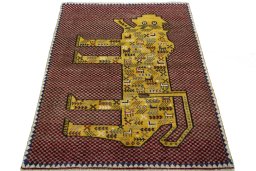 Surface texture of 2000s Persian Gabbeh rug with natural Wool and intricate pattern