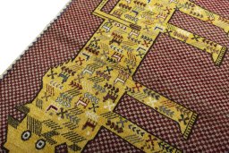 Backside of handmade 2000s Persian Gabbeh rug showing knot structure and weave density
