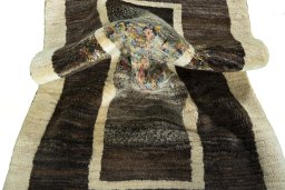 Corner detail of New Persian Gabbeh rug showing border pattern and Wool pile