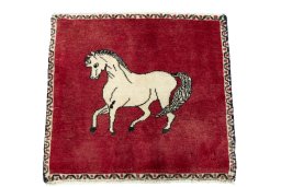 Surface texture of 2000s Persian Gabbeh rug with natural Wool and intricate pattern