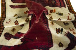 Corner detail of 1970s Persian Gabbeh rug showing border pattern and Wool pile