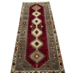 Surface texture of 2000s Persian Gabbeh rug with natural Wool and intricate pattern