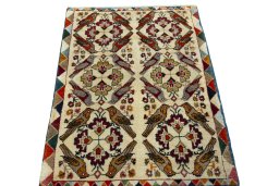 Surface texture of 2000s Persian Gabbeh rug with natural Wool and intricate pattern