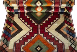 Corner detail of 2000s Persian Gabbeh rug showing border pattern and Wool pile