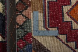 Surface texture of 2000s Persian Gabbeh rug with natural Wool and intricate pattern
