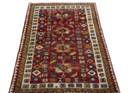 Surface texture of 2000s Persian Gabbeh rug with natural Wool and intricate pattern