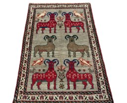 Surface texture of 2000s Persian Gabbeh rug with natural Wool and intricate pattern