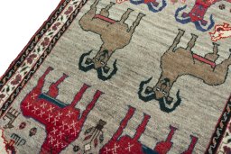Backside of handmade 2000s Persian Gabbeh rug showing knot structure and weave density