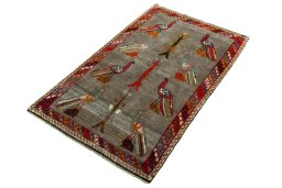 Corner detail of 2000s Persian Gabbeh rug showing border pattern and Wool pile