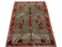 Surface texture of 2000s Persian Gabbeh rug with natural Wool and intricate pattern